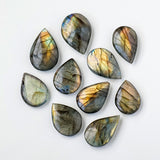 Natural Crystal Blue Light Elongates Stone Droplets